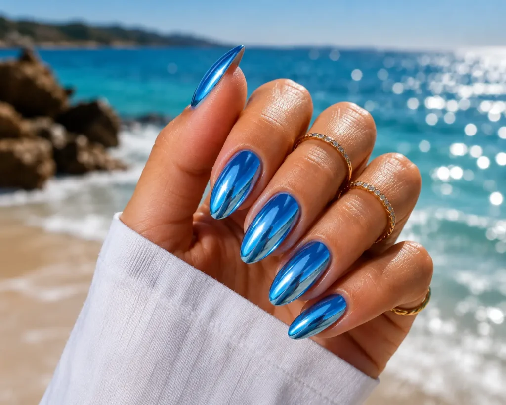 Ocean blue chrome summer nail design.