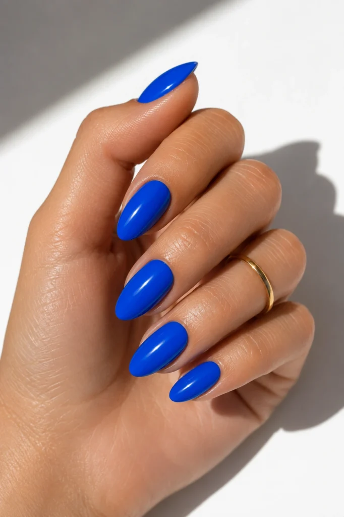 Electric cobalt blue summer nails 2026 with a bold glossy finish