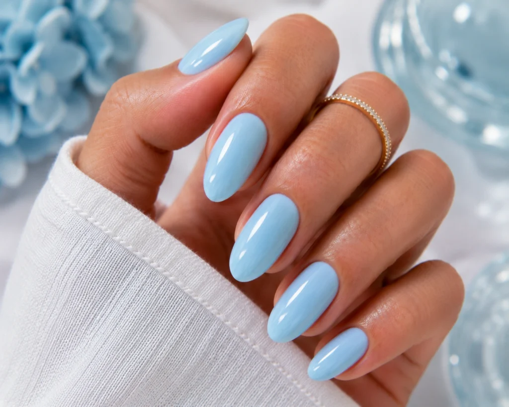 Glossy ice blue nails with elegant summer style