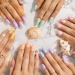 Pastel Summer Nail Colors 2026 featuring butter yellow, lavender, mint green, peach, baby pink, and powder blue nails.