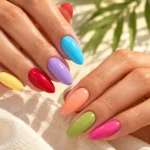 Trending summer nail color ideas 2026 featuring bright and pastel glossy manicure shades